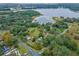 Aerial view of property showing home, large lot, and lake access at 1399 Old Mount Dora Rd, Eustis, FL 32726