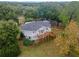 Elevated circular home with deck and large lot, nestled among trees at 1399 Old Mount Dora Rd, Eustis, FL 32726