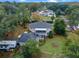 Aerial view of unique home with large yard and RV parking at 1399 Old Mount Dora Rd, Eustis, FL 32726