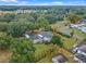 Aerial view of a two-story house with a large backyard and garden at 1399 Old Mount Dora Rd, Eustis, FL 32726
