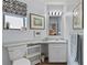 Clean bathroom with single sink vanity and updated fixtures at 1399 Old Mount Dora Rd, Eustis, FL 32726