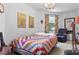Comfortable bedroom with a queen-size bed and colorful quilt at 1399 Old Mount Dora Rd, Eustis, FL 32726