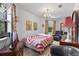 Cozy bedroom with a patchwork quilt and comfortable seating at 1399 Old Mount Dora Rd, Eustis, FL 32726