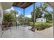 White deck with a table and chairs, overlooking the backyard at 1399 Old Mount Dora Rd, Eustis, FL 32726