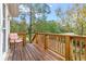 Wooden deck with railing and scenic backyard views at 1399 Old Mount Dora Rd, Eustis, FL 32726