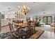 Spacious dining area with chandelier and access to kitchen and living areas at 1399 Old Mount Dora Rd, Eustis, FL 32726
