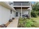 Two-story house with a deck, walkway, and landscaping at 1399 Old Mount Dora Rd, Eustis, FL 32726