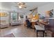 Living room with hardwood floors, piano, and home office at 1399 Old Mount Dora Rd, Eustis, FL 32726
