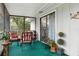 Relaxing screened porch with seating and lush greenery views at 1399 Old Mount Dora Rd, Eustis, FL 32726
