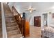Wooden staircase leading to the upper level of the home at 1399 Old Mount Dora Rd, Eustis, FL 32726