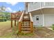 Wooden stairs leading up to a raised deck at 1399 Old Mount Dora Rd, Eustis, FL 32726