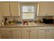 Practical kitchen area with essential appliances and abundant storage space at 1456 N Page Dr, Deltona, FL 32725