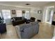 Bright living room featuring neutral tones, comfortable seating, and natural light at 1456 N Page Dr, Deltona, FL 32725