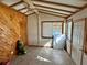 Bright sunroom featuring tile floor, exposed beam ceiling and a window for natural light at 1456 N Page Dr, Deltona, FL 32725