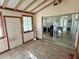 Bright sunroom with tile flooring, exposed beam ceiling and sliding glass door leading to living area at 1456 N Page Dr, Deltona, FL 32725