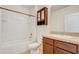 Bathroom with tub, toilet, vanity, and linen cabinet at 273 St Georges Cir, Eagle Lake, FL 33839