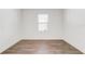 Simple bedroom with vinyl flooring and window blinds at 273 St Georges Cir, Eagle Lake, FL 33839