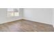 Spacious bedroom with wood-look flooring at 273 St Georges Cir, Eagle Lake, FL 33839