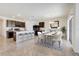 Modern kitchen with island, stainless steel appliances, and breakfast bar at 273 St Georges Cir, Eagle Lake, FL 33839