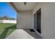 Covered patio with sliding glass doors at 273 St Georges Cir, Eagle Lake, FL 33839