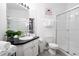 Vanity with dark countertop, glass shower, and toilet at 2821 Almaton Loop # 101, Kissimmee, FL 34747