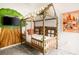 Cozy bedroom with a unique wooden bed frame and fun wall art at 2821 Almaton Loop # 101, Kissimmee, FL 34747
