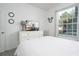 Bright bedroom with a comfortable bed, dresser, and large window at 2821 Almaton Loop # 101, Kissimmee, FL 34747