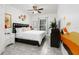 King bedroom with black framed bed, and decorative wall art at 2821 Almaton Loop # 101, Kissimmee, FL 34747