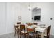 Dining area with white table and wooden chairs, seats six at 2821 Almaton Loop # 101, Kissimmee, FL 34747