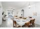 Bright dining area with a white table and wooden chairs, seats six at 2821 Almaton Loop # 101, Kissimmee, FL 34747
