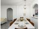 Spacious dining room with large white table, and eight chairs at 2821 Almaton Loop # 101, Kissimmee, FL 34747