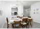 Modern dining room with white table and six mid-century chairs at 2821 Almaton Loop # 101, Kissimmee, FL 34747