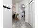 Bright entryway with tile flooring, coat rack, and view into dining area at 2821 Almaton Loop # 101, Kissimmee, FL 34747