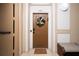 Inviting condo entry with a brown door, wreath, and mat at 2821 Almaton Loop # 101, Kissimmee, FL 34747