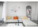 Living room with white sectional sofa and view of bathroom at 2821 Almaton Loop # 101, Kissimmee, FL 34747