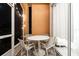 Small patio with a round table and four chairs, perfect for relaxing at 2821 Almaton Loop # 101, Kissimmee, FL 34747