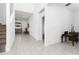 Bright hallway with tiled floors and views of living and Gathering rooms at 285 Miro Dr, Davenport, FL 33837