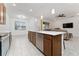 Kitchen island with white countertop and stainless steel dishwasher at 285 Miro Dr, Davenport, FL 33837