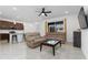 Open concept living room and kitchen with modern furniture at 285 Miro Dr, Davenport, FL 33837