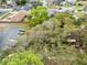 Aerial view highlighting the community's tree-lined streets and well-maintained properties with available parking spots at 4008 Crossroads Pl, Casselberry, FL 32707