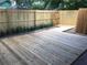 Private backyard with wooden deck, wooden fence, and gate at 4008 Crossroads Pl, Casselberry, FL 32707
