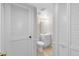 Hall bathroom with good lighting, tile floors, vanity and toilet at 4008 Crossroads Pl, Casselberry, FL 32707