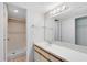 Bathroom featuring a large mirror, vanity, and walk-in shower at 4008 Crossroads Pl, Casselberry, FL 32707