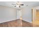 Bedroom with hardwood floors and door to a hallway with tile flooring at 4008 Crossroads Pl, Casselberry, FL 32707