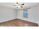 Bedroom with hardwood floors, ceiling fan and window with wood blinds at 4008 Crossroads Pl, Casselberry, FL 32707