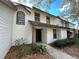 Two-story townhome with brick accents and a walkway at 4008 Crossroads Pl, Casselberry, FL 32707