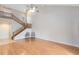 Spacious living room with high ceiling, stairs, and chairs at 4008 Crossroads Pl, Casselberry, FL 32707