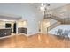 Large living room with stairs, wood floors, and connection to the kitchen at 4008 Crossroads Pl, Casselberry, FL 32707