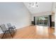 Living room with high vaulted ceilings, wood floors and sliding doors to the backyard at 4008 Crossroads Pl, Casselberry, FL 32707