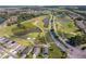 Aerial view of community with golf course and homes at 510 Canary Island Cir, Davenport, FL 33837